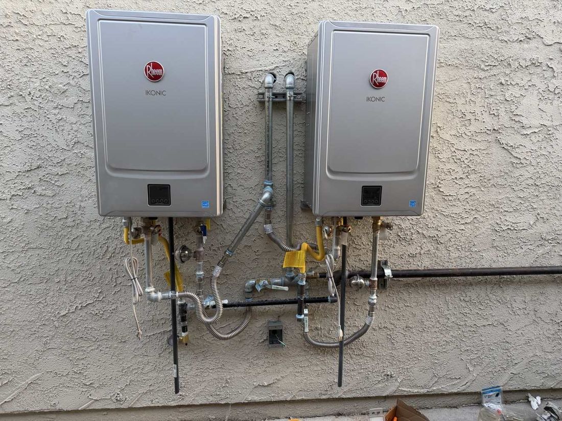 Two Rheem IKONIC tankless units installed outdoors