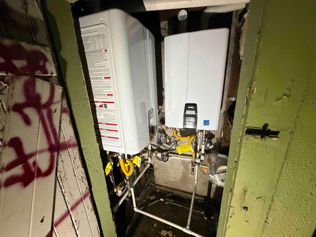 Two Navien tankless units installed in a closet