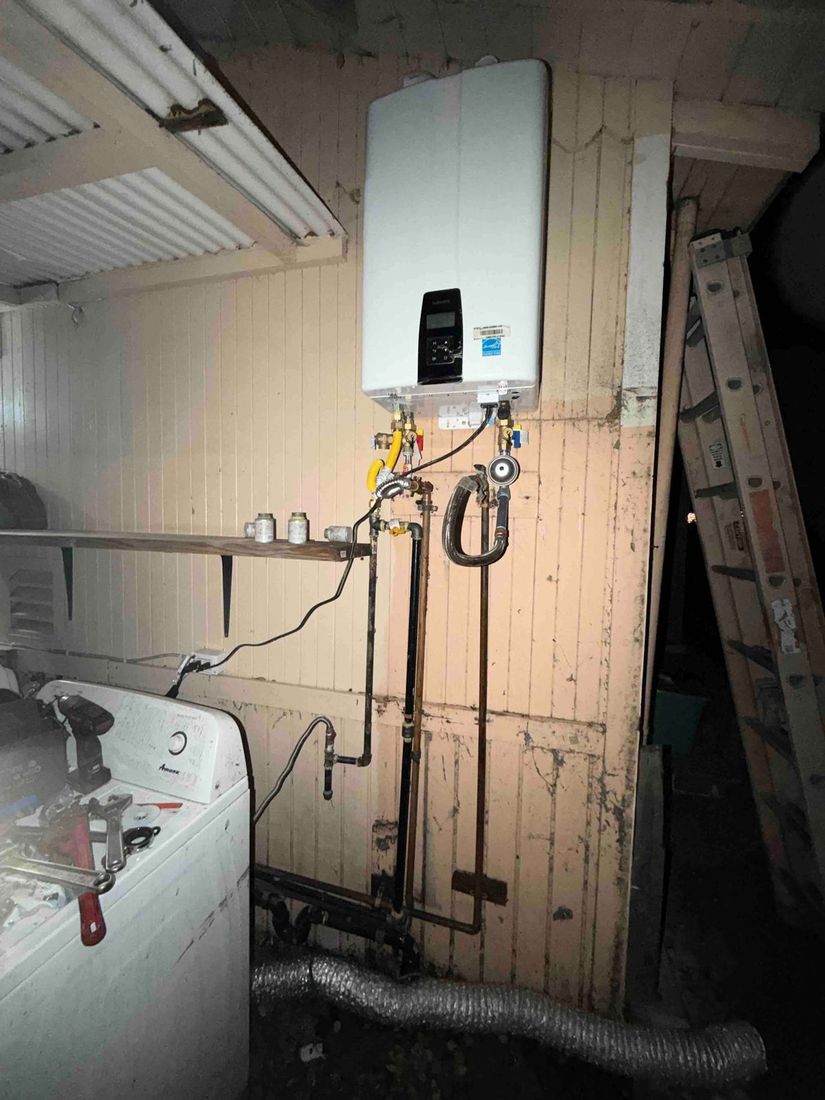Navien tankless installed above a washer and dryer