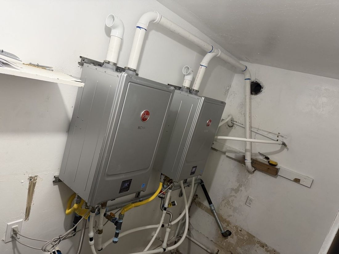 Two Rheem IKONIC tankless units installed indoors