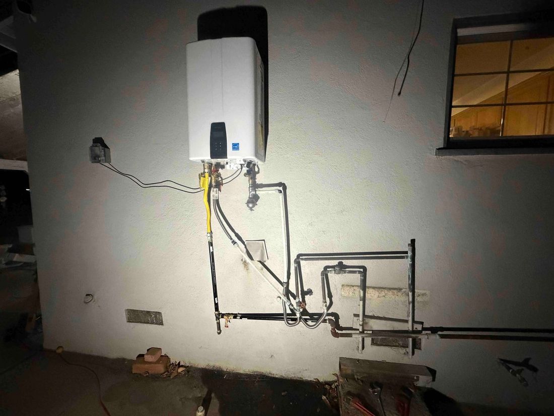 Navien tankless installed on a garage wall