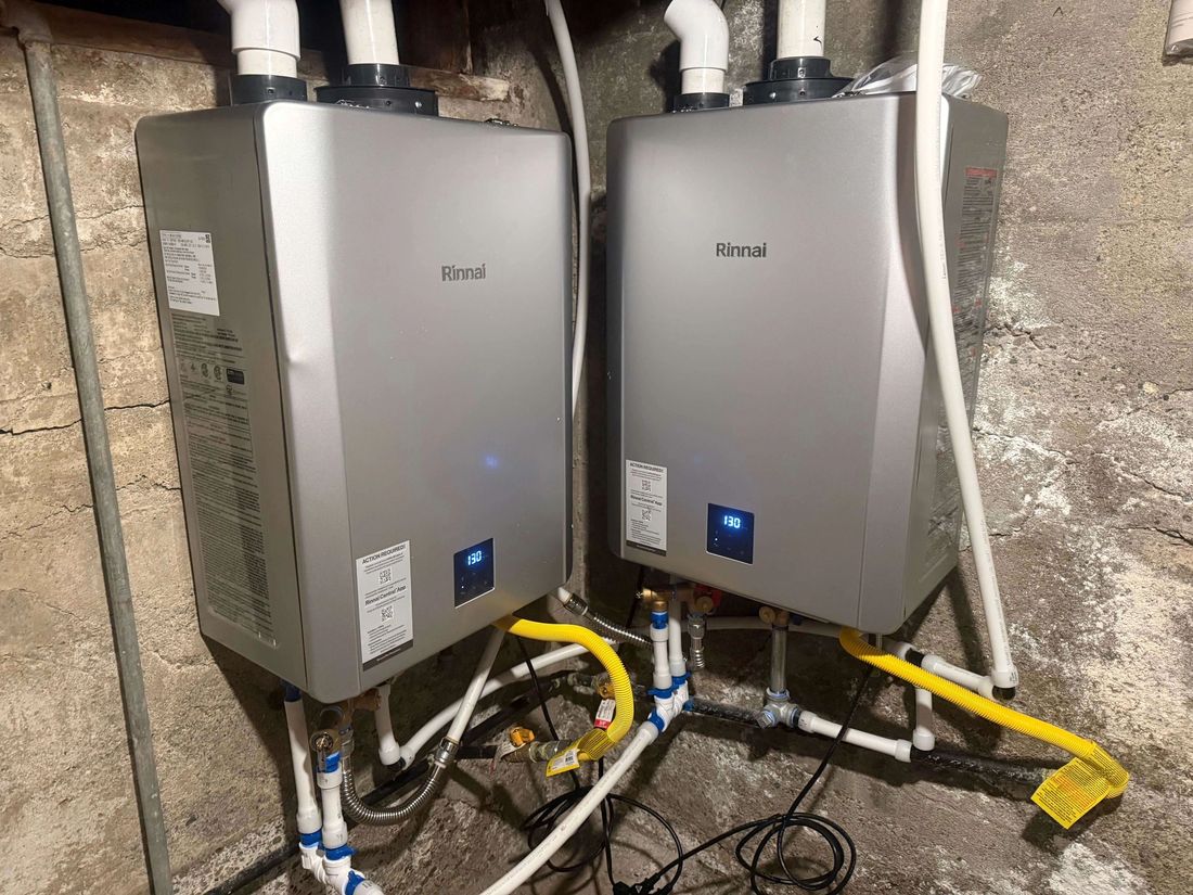 Two tankless water heaters installed side by side